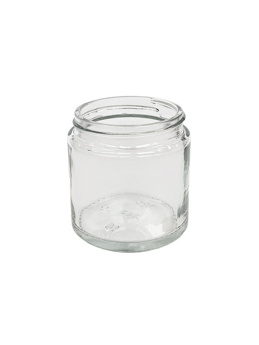 Comandante Kaffebønne Glas, Klart, har en bred åbning og kort cylindrisk form for optimal opbevaring af kaffebønner, sat mod en almindelig hvid baggrund.