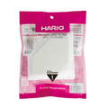 En pink og hvid pakke med Hario, en kop drypfilter fra Hario, indeholder 22 engangskaffefiltre til en kop. Emballagen viser japansk og engelsk tekst med et synligt filter indeni.
