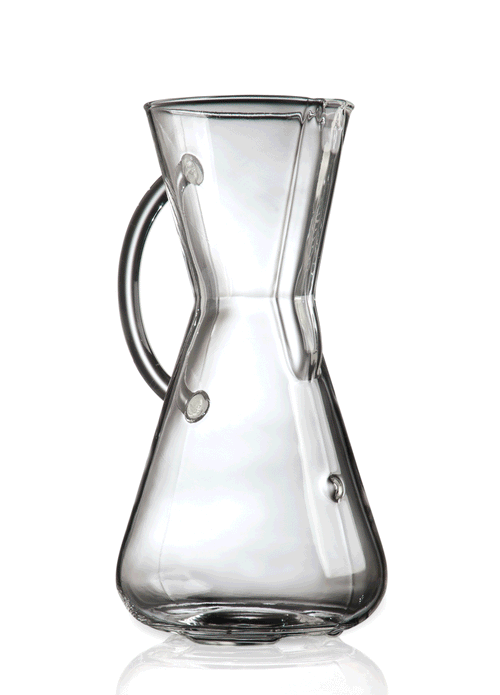 The Chemex Kaffebrygger med håndtag fra Chemex er en klar, timeglasformet karaffel med et lille håndtag - ideel til pour-over teknik og brygning af rig filterkaffe, vist tom mod en hvid baggrund.
